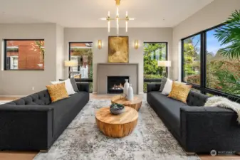The heart of the home is the open living room that flows into the dining area and epicurean luxe kitchen, all connected with ever-present natural light and consistent aesthetic.