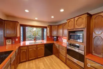 Oversized kitchen with plenty of counters, storage and open space,