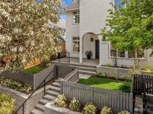 Fenced yard and elevated front porch greet you.