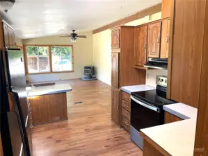 Entering through that doorway and looking across the kitchen to the family room.