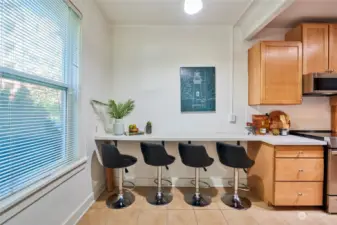 Plenty of space in breakfast bar for entertaining located just off living room.