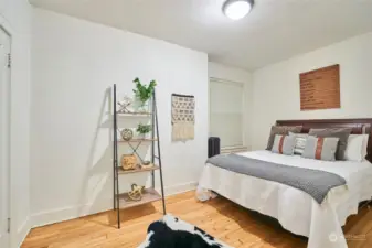 Large bedroom with beautiful hardwoods and plenty of closet space.