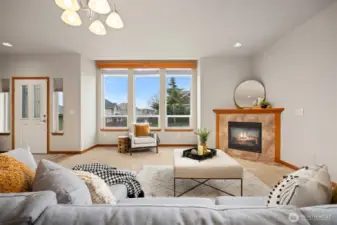 Welcome inside the home! There is a lovely living room with a gas fireplace and a large picture window that looks to the north and the Canadian Mountains.