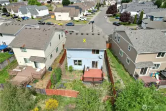 Aerial view of the fenced back yard