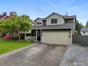 With extended driveway and fresh sod in front yard.