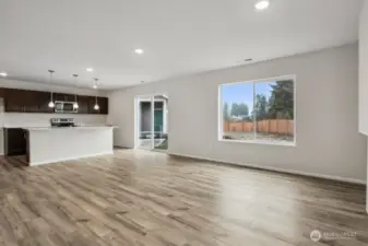 Open concept living/dining/kitchen-Discalimer-Disclaimer- Photos are of another Lina floor plan from a previous community, photos are for illustrative purposes only. Finishes, flooring, upgrades, or other features may vary.