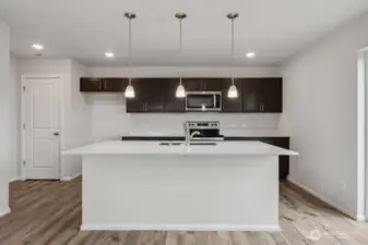 Open concept living/dining/kitchen-Discalimer-Disclaimer- Photos are of another Lina floor plan from a previous community, photos are for illustrative purposes only. Finishes, flooring, upgrades, or other features may vary.