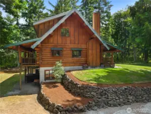 Escape to your own private retreat in this stunning three-story log home nestled amidst the breathtaking beauty of the Pacific NW.