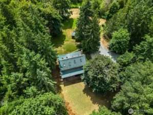 This three-story log home is an ideal choice for those seeking a rustic yet comfortable lifestyle, embracing the charm of a bygone era while enjoying the conveniences of modern living.
