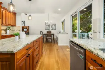 Slab granite counters over quality wood cabinets and real hardwood floors