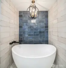 Elegant floating tub & well-appointed chandelier