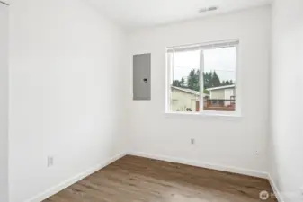 This office doesn’t scream, it just sets the stage. Vinyl plank flooring and a large window keep it bright and durable, white walls are ready for whatever vibe you want, and the breaker box is easy to hide with wall art. Whether you’re working from home, gaming, or carving out a creative corner, this room is ready to earn its keep.