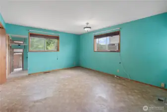 Primary bedroom with dual closets and a portable A/C unit.