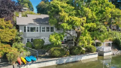 Beautiful, custom home on East Bay Drive complete with gazebo, kayak launch and concrete steps to the 76 foot bulkhead.