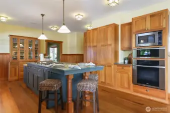 Notice the custom built-ins, stainless meille oven, warming drawer and microwave.