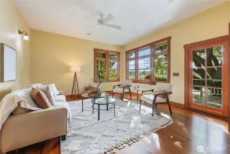 Family room with lots of light, fan and door leading to deck overlooking Budd Bay.