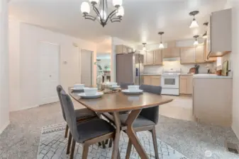 Dining off kitchen, yet can see through to living room. Walk-in pantry through door