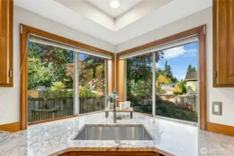 Take a peek out the kitchen windows while you wash dishes in the under-mounted sink.
