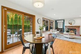 Move from the breakfast area back to the family room. Exposed brick gas fireplace adds warmth to the space.