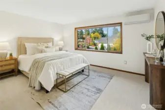 Pop upstairs to check out the primary bedroom, complete with ensuite, walk-in closet, and mini split for perfect temperature regulation.