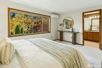 Enjoy a beautiful seasonal view of your backyard, and enter your ensuite.