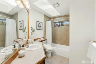 Upstairs full guest bath with installed bidet ensures comfort for all.