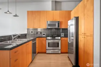 Treat the cook to granite surfaces & built-in stainless appliances.