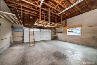 Oversized two car garage with storage space.LADDER takes you up to an additional storage area sitting above the garage.