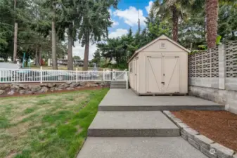 Front yard area, with storage shed.