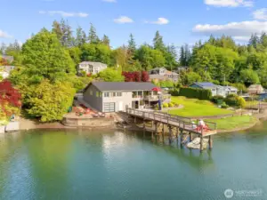 Prepare to play all day at this waterside retreat! A dock is so valuable in our area - it's now so challenging to get permits for a new one, so bring your boat or just do cannonballs (at high tide) off this one!