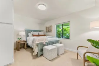 The guest room is charming and delightful, with multiple options for closet space, including a walk-in closet!