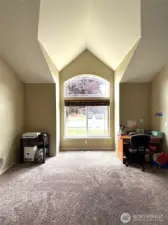 Living room off of dining room, with dramatic ceiling