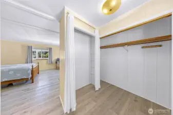 Primary bedroom dressing area with 2 closets
