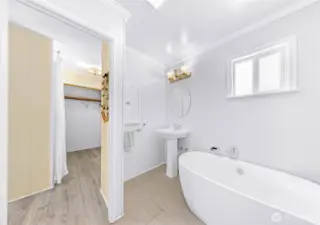 Primary bathroom updated with self-standing tub