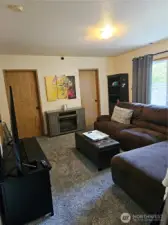 Bonus room (lower lever), newer carpet, and back sliding door.