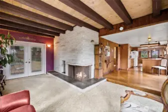 Mid-mod vibes in Living Room. French Doors to deck
