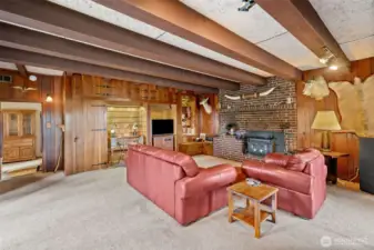 Fun and homey Family Room with natural wood accents and exposed beams
