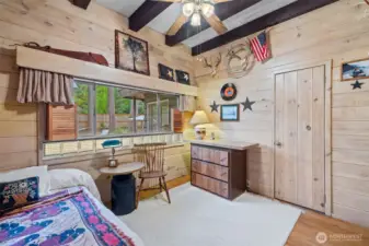 Sweet bedroom with exposed beam ceiling