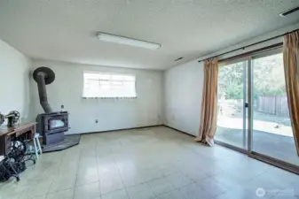 Lower Level Family Room With Rear Yard And Garage Access