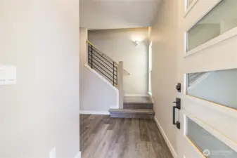 Spacious entry with stairs leading to upstairs bedrooms
