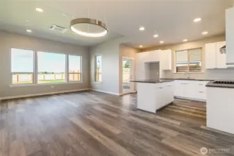 Living/Dining/Kitchen flooded in natural light