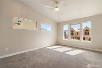 Upstairs primary suite with lots of natural light