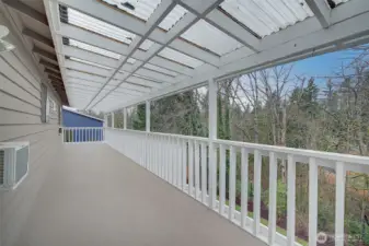 Upper covered deck runs the length of the house.