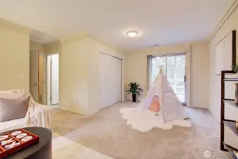 Rec room/bedroom with sliding door to lower deck.