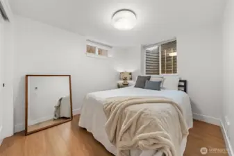 Lower-level Bedroom Five offers privacy and versatility within the fully permitted ADU, complete with modern finishes, large closet, recessed lighting and LVP flooring.