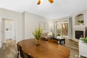 The dining area sits comfortably between kitchen and living spaces, creating an ideal layout for gatherings. Enjoy meals surrounded by natural light and serene greenbelt views.