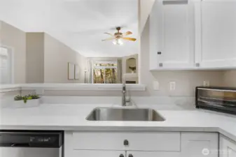 The kitchen flows seamlessly into the living and dining areas, keeping everyone connected.