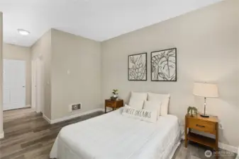 The generous layout easily accommodates full bedroom furnishings with room to spare. An oversized walk-in closet provides exceptional storage and organization.