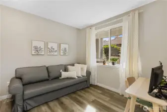 The secondary bedroom offers flexibility to meet a variety of lifestyle needs. Ideal as a guest room, home office, or creative workspace.