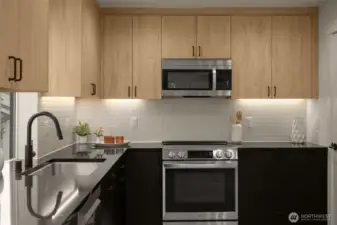 Designer kitchen with sleek cabinetry, quartz countertops, and premium appliances